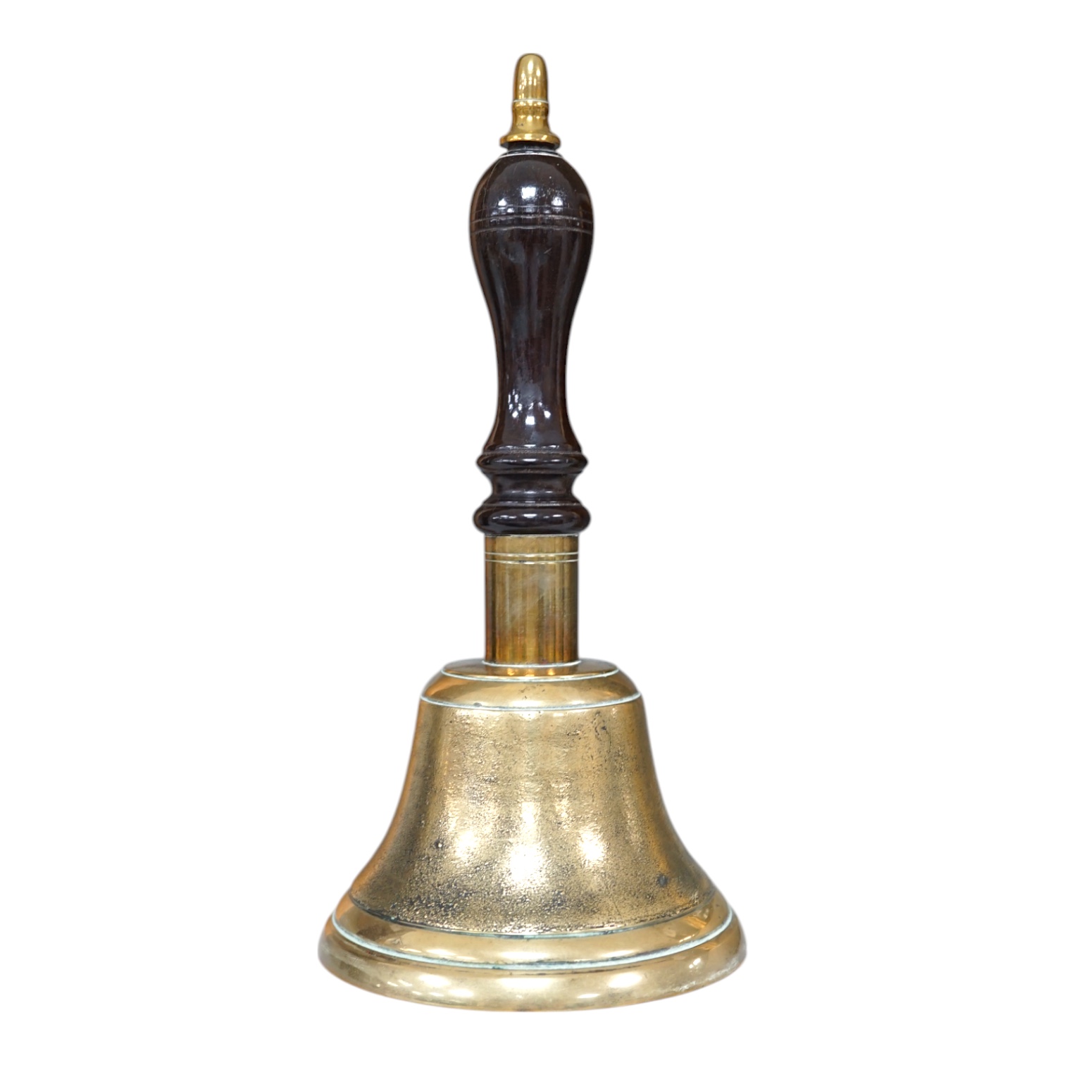 A late 19th/early 20th century brass school bell, with a turned mahogany handle, bell diameter 12.5cm, height 26cm. Condition - fair to good.